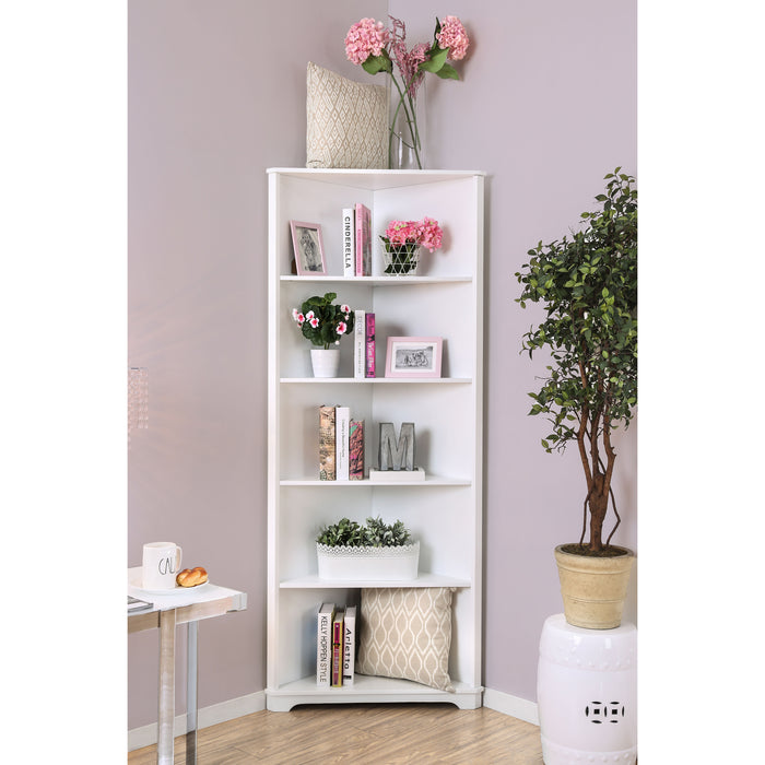 Front-facing contemporary white solid wood five-shelf corner bookcase in a living area with accessories