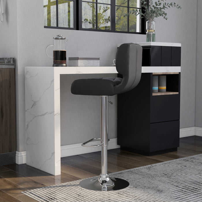 Left-angled  grey leatherette bar chair against with accessories. The biscuit tufted swivel seat is a modern look against the chrome pedestal base with footrest.