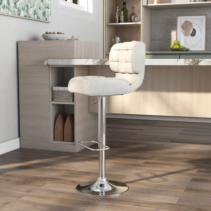 Left-angled  white leatherette bar chair against with accessories. The biscuit tufted swivel seat is a modern look against the chrome pedestal base with footrest.