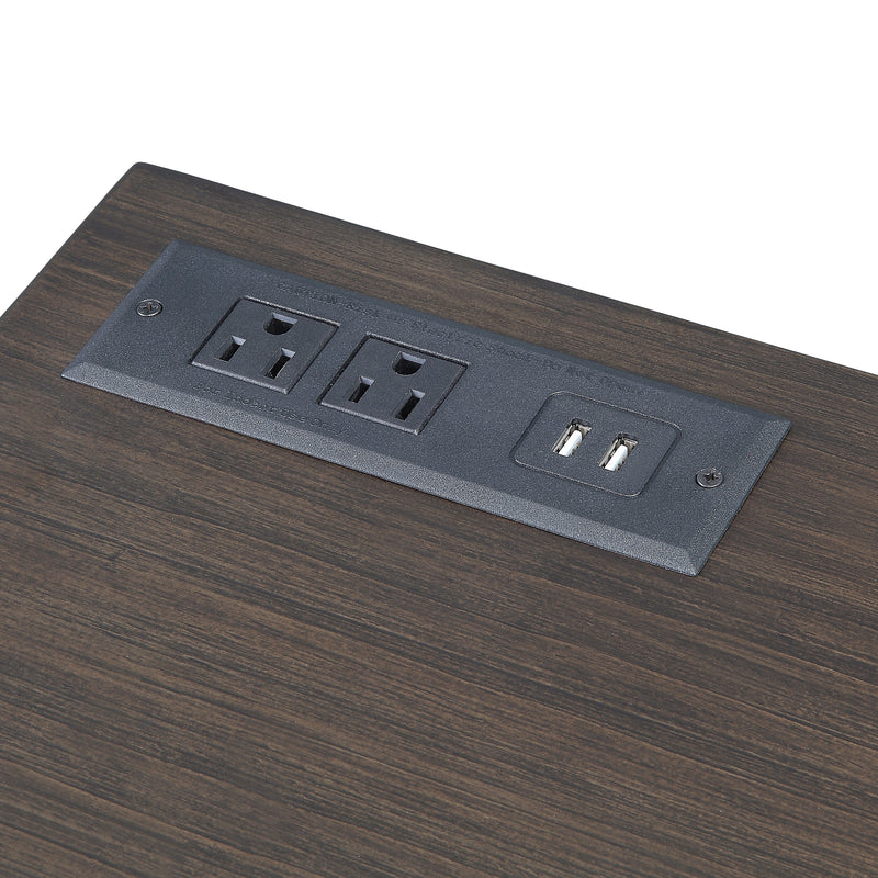 Angled view of desktop corner power panel on walnut finish mid-century modern writing desk on white background