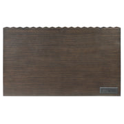 Top-down facing view of desktop of walnut finish mid-century modern writing desk with drawer on white background