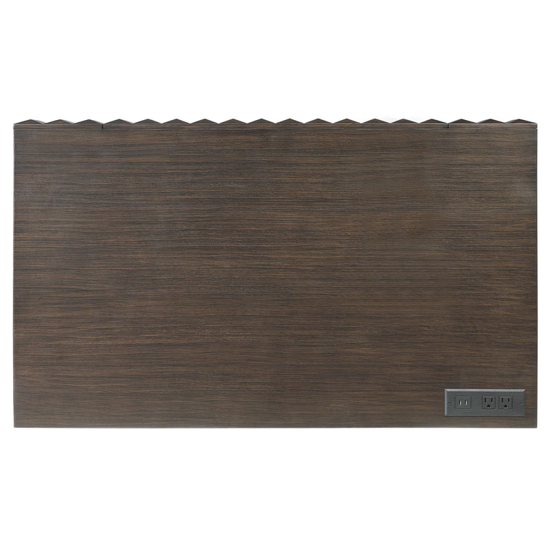 Top-down facing view of desktop of walnut finish mid-century modern writing desk with drawer on white background