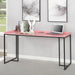 Angled right-facing view of pink metal and MDF urban desk in living space with accessories