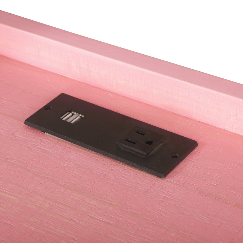Angled incomplete top-down view of desktop back edge section of pink metal and MDF urban desk with charging outlets on white background