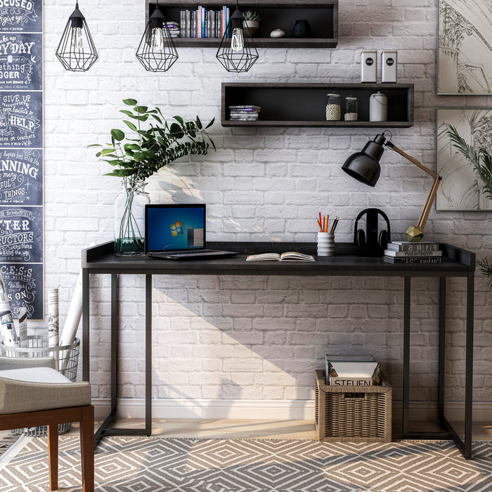Front-facing view of black metal and MDF urban desk in living room with accessories
