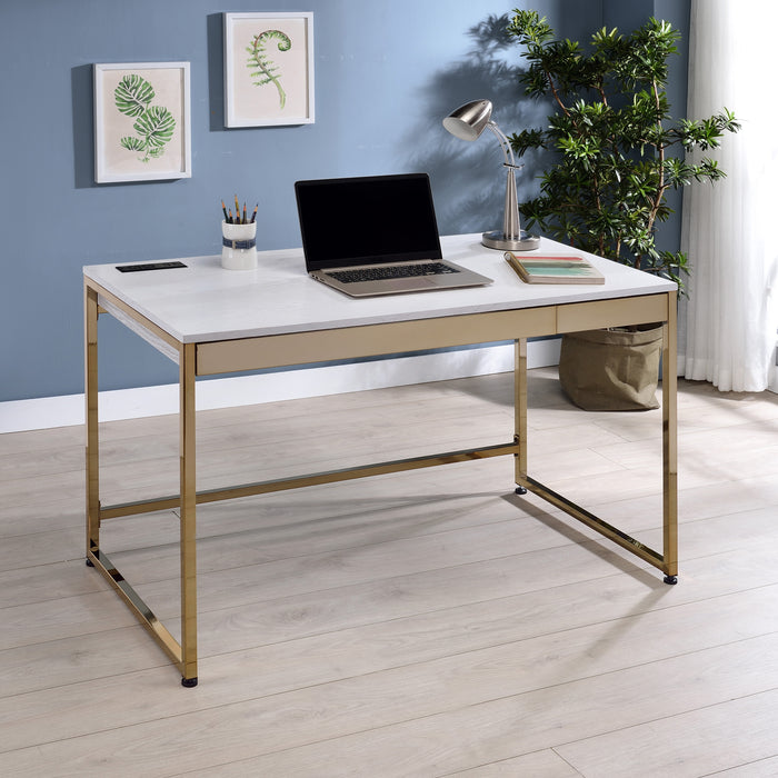 Angled right-facing elevated view of white and copper plating finish glam steel and wood desk in living space with accessories