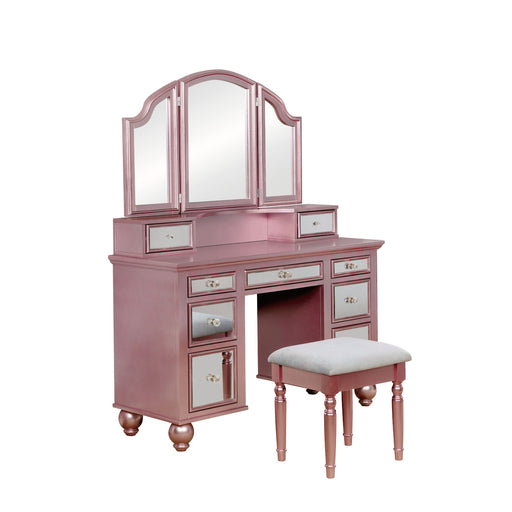 Right-angled rose gold vanity set against a white background. This vanity table offers a tri-fold mirror and a total of nine mirrored drawers with acrylic knobs. Bun feet hold up the vanity table, while turned legs prop up a fabric-top stool.