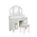 Right-angled white vanity set against a white background. This vanity table offers a tri-fold mirror and a total of nine mirrored drawers with acrylic knobs. Bun feet hold up the vanity table, while turned legs prop up a fabric-top stool.