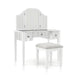 Right-angled white vanity set against a white background. This vanity table features a trifold mirror, mirrored tabletop, and stripe frosted mirrored drawers with acrylic knobs. It stands on long tapered legs to match the fabric-top stool.
