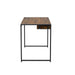 Angled side-facing view of contemporary sand black and natural tone steel and particle board writing desk on white background