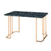 Angled right-facing view of contemporary gold steel and black marble top writing desk on white background