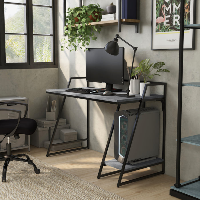Angled right-facing  view of urban light gray and matte black steel writing desk with accessories
