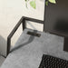 Left-angled close up of urban light gray and matte black steel writing desk with accessories