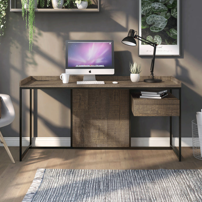 Front facing industrial one-drawer rustic oak and black writing desk with power outlets and USB ports in a living area with accessories