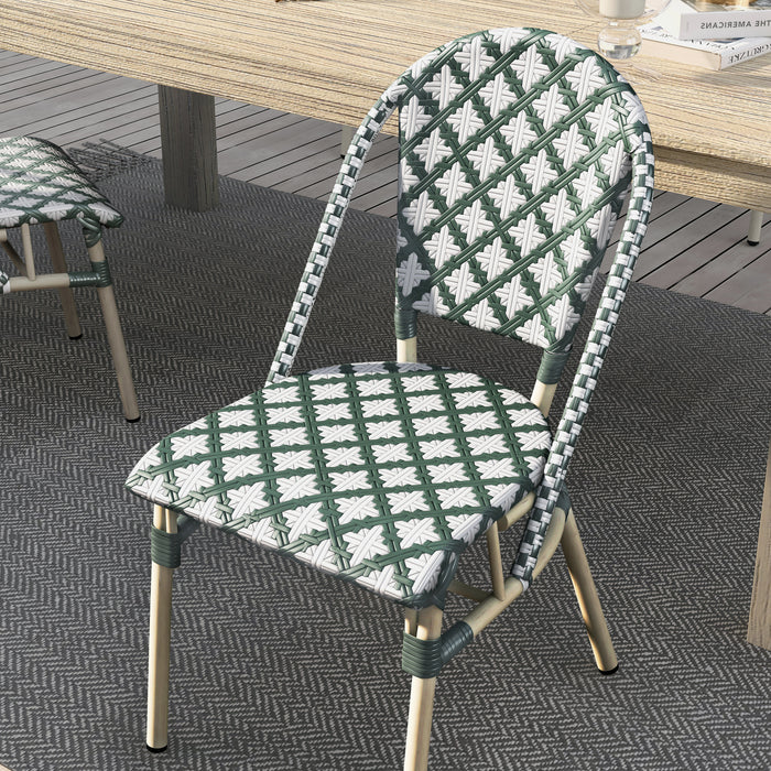 Top view of a green patterned wicker bistro chair in a bohemian style dining space.