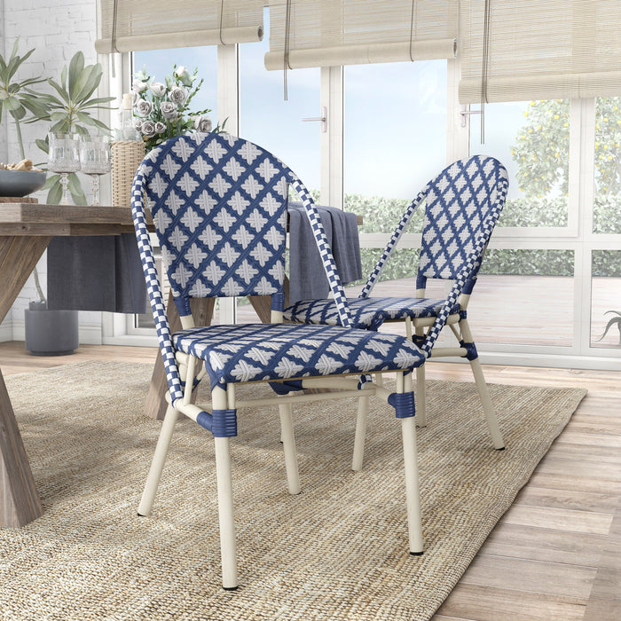 Blue and white octofoil patterned chairs in a contemporary dining room.