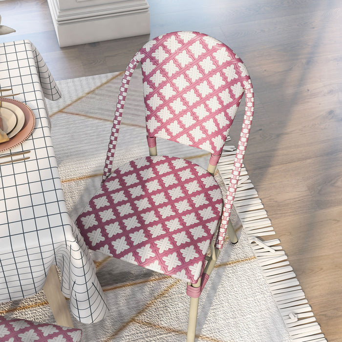 Top view of a pink patterned wicker bistro chair in a bohemian style dining room.