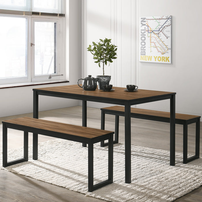 Left angled walnut and black three piece dining table set with benches in a dining room with accessories