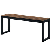 Left angled walnut and black bench on a white background