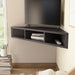 Left-angled close up modern cappuccino floating corner TV stand in a living area with accessories