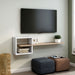 Angled view of modern white and natural finish geometric floating TV stand