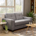 Right-angled contemporary gray upholstered loveseat with tufted back cushions and wide track arms in a contemporary living room