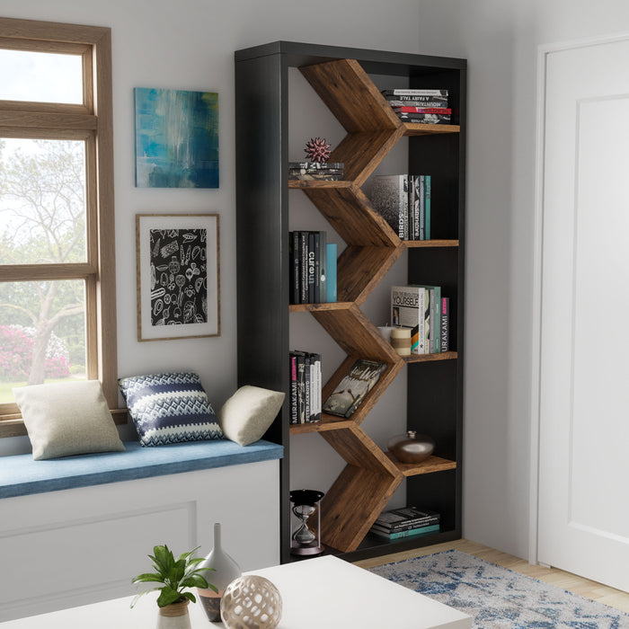 Angled left-facing view of contemporary geometric black and dark walnut finish bookcase in living space with accessories