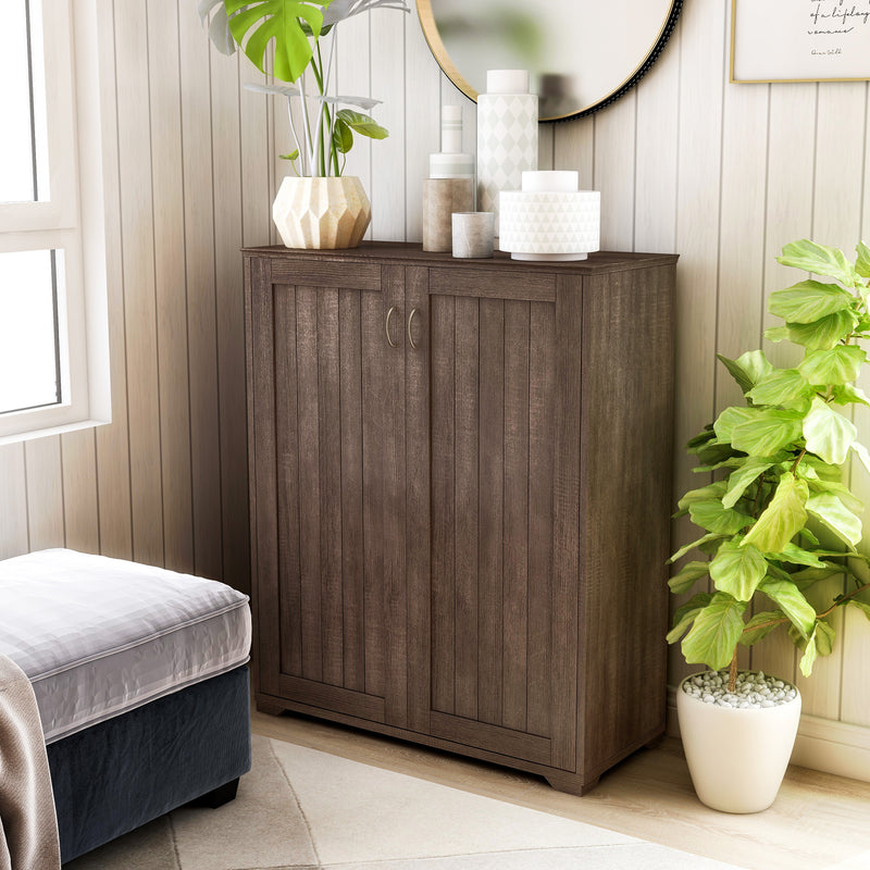 Angled right-side facing view of contemporary walnut oak finish shoe cabinet in living space with accessories