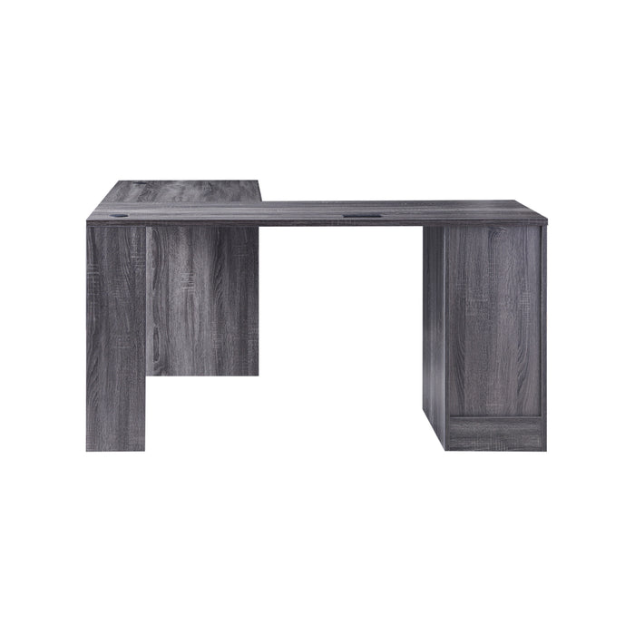 Left-side facing view of modern dark gray finish L-shaped desk with storage on white background