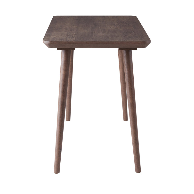 Side-facing view of contemporary walnut oak finish writing desk on white background