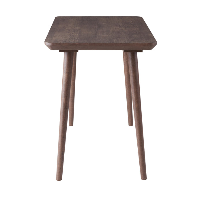 Side-facing view of contemporary walnut oak finish writing desk on white background