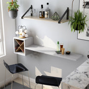 Left angled cottage style white floating wine bar with stemware racks in a living area with accessories