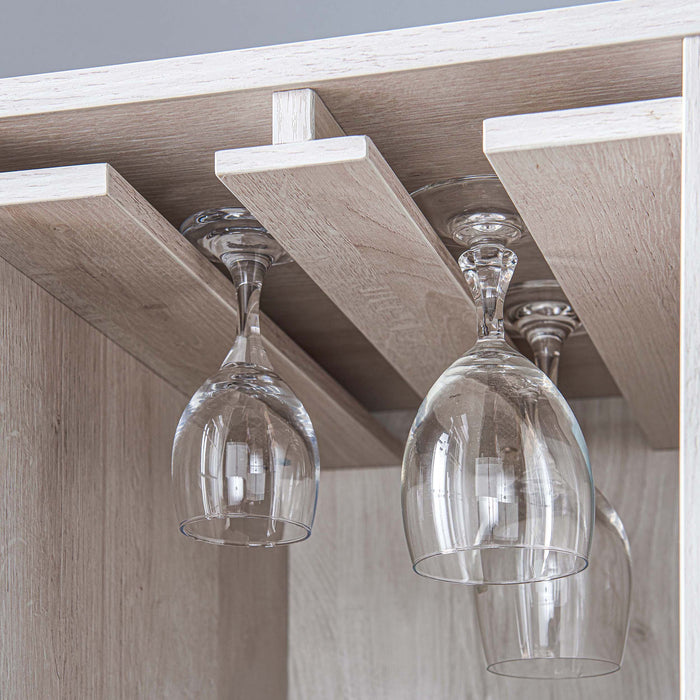 Left angled stemware rack close up of a contemporary white oak multi-shelf wine cabinet in a living space with wine glasses