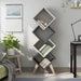 Front-facing modern four-cube stacked bookcase in white oak and distressed gray with accessories