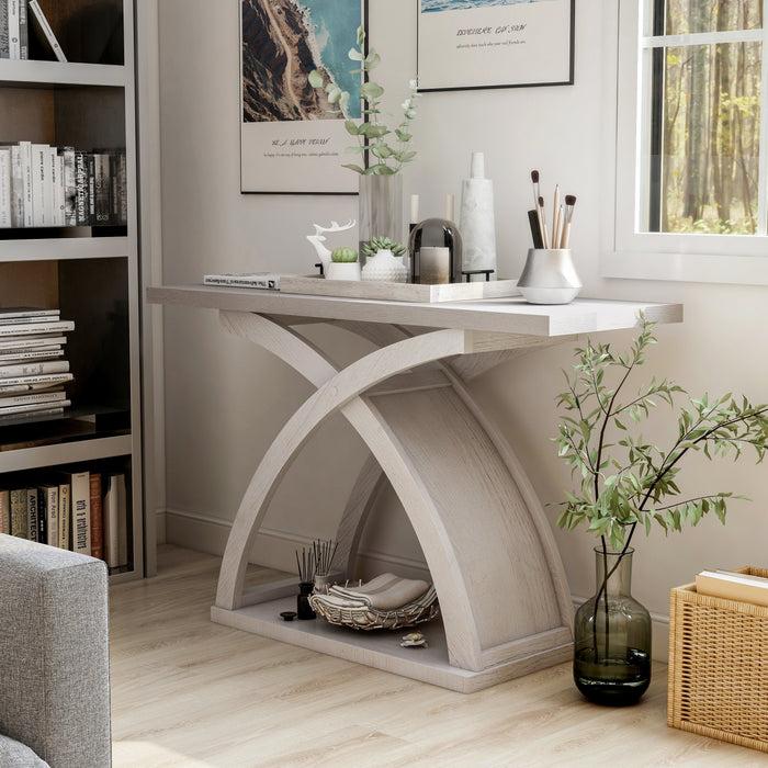 Left angled transitional white oak console table in a living room with accessories