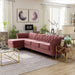 Left-angled glam rose pink upholstered sectional with left-facing chaise, flared arms, and button tufted back in a contemporary living room with accessories