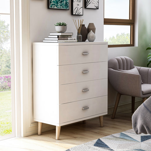 Right angled mid-century modern white four-drawer tall dresser in a living area with accessories
