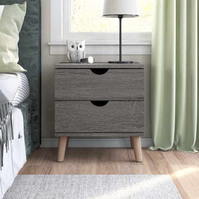 Front-facing mid-century modern distressed gray two-drawer nightstand in a bedroom with accessories