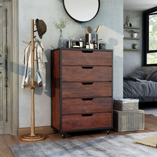 Right-angled vintage walnut 5-drawer chest in a rustic bedroom. A tissue box, lotions, and cosmetics sit on the rustic plank-style paneling.