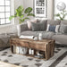 Front-facing rustic reclaimed barnwood storage coffee table on a white background