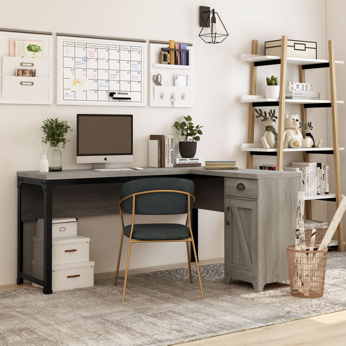 Right angled farmhouse vintage gray oak L-shaped desk in a home office with accessories