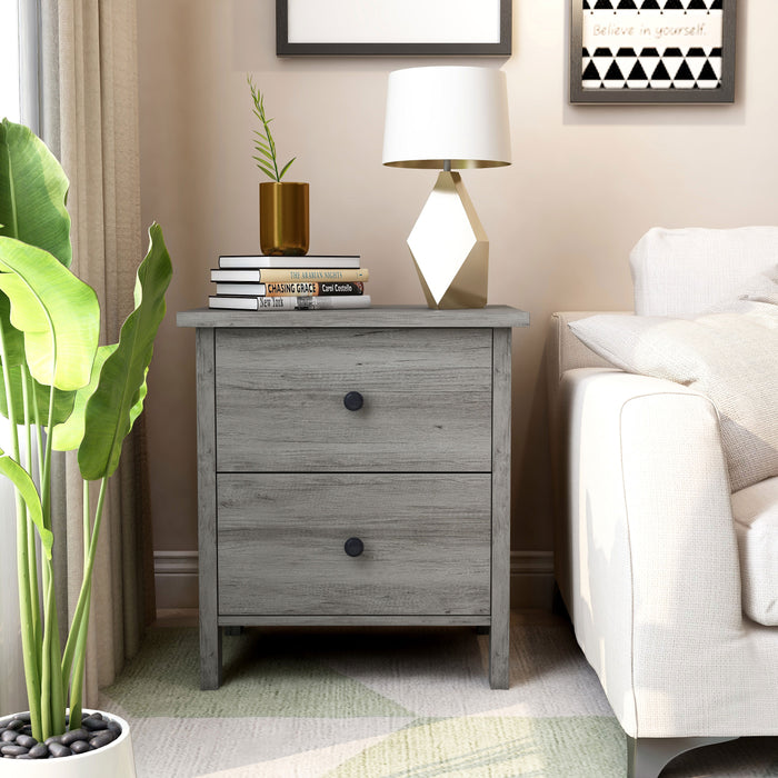 Front-facing transitional vintage gray oak two-drawer nightstand in a living room with accessories
