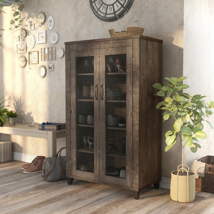 Left-facing rustic reclaimed oak shoe cabinet in foyer displaying shoes behind chicken wire cabinet doors.