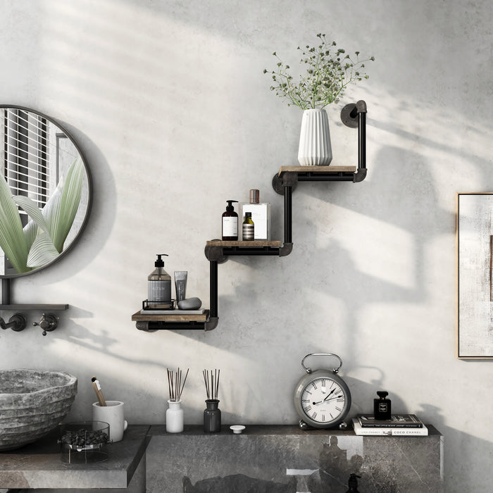 Front-facing industrial staggered three-tier wall shelf with pipe-style framing and reclaimed oak surfaces in an urban bathroom