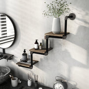Left-angled industrial staggered three-tier wall shelf with pipe-style framing and reclaimed oak surfaces in an urban bathroom