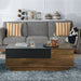 Front-facing contemporary light hickory storage coffee table in a living room with accessories