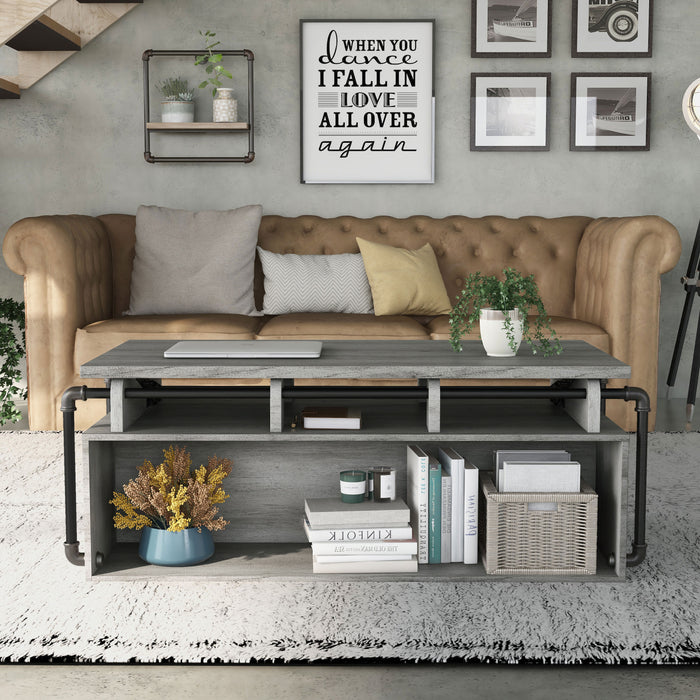 Front-facing industrial vintage gray oak lift-top coffee table with shelves in a living room with accessories