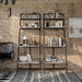 Front-facing industrial vintage gray oak four-shelf leaning accent bookcases on a white background