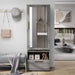 Front-facing amoire with mirror in a vintage gray oak finish in a room with accessories