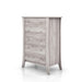 Left angled transitional coastal white five-drawer tall dresser with splayed legs on a white background